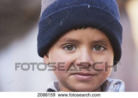 Stock Photo - Boy In A Relief Camp After The 8 October 2005 Earthquake, Bagh, Azad Kashmir, Pakistan. Fotosearch