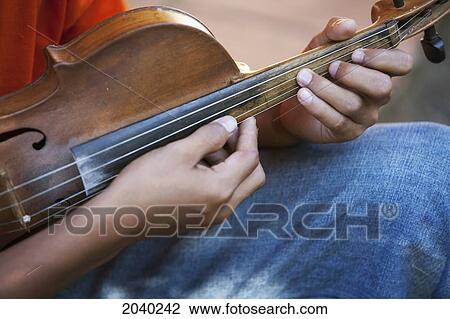 Boy Playing A Violin At The Jesuit Mission Of Santa Ana De Velasco, Santa Cruz Department, Bolivia View Large Photo Image Stock Image - Boy Playing A Violin At The Jesuit Mission Of Santa Ana De Velasco, Santa Cruz Department, Bolivia. Fotosearch