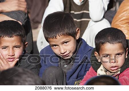 Stock Photograph - Boys Attending A Class In The Grounds Of A School In Destroyed By The 8 October 2005 Earthquake, Chakothi, Azad Kashmir, Pakistan. Fotosearch