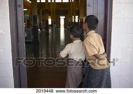 Boys Looking In A Doorway, Inle Lake, Myanmar (Burma) View Large Photo Image Stock Photo - Boys Looking In A Doorway, Inle Lake, Myanmar (Burma). Fotosearch