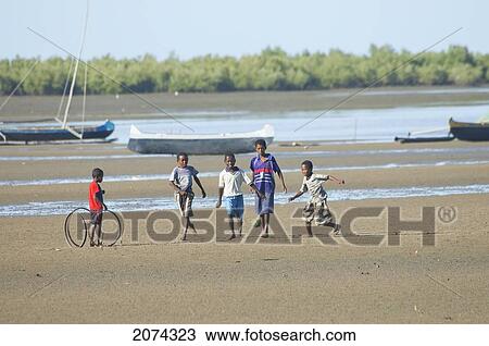 Boys Playing Football On The Beach In Mahavatse, Toliara Province, Madagascar View Large Photo Image Stock Image - Boys Playing Football On The Beach In Mahavatse, Toliara Province, Madagascar. Fotosearch