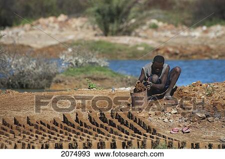 Stock Image - Brick Makers, Antsokay, Toliara Province, Madagascar. Fotosearch