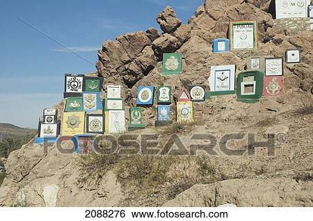 Stock Photograph - British Indian Regimental Badges Carved Into The Rock Face, Khyber Pass, Federally Administered Tribal Areas, Pakistan. Fotosearch