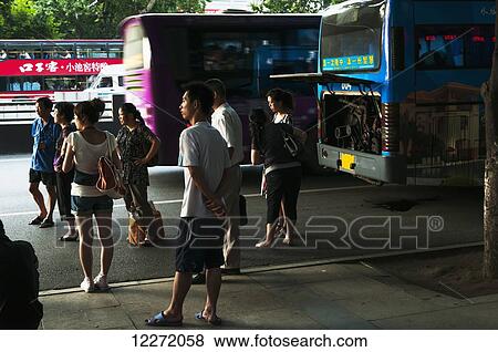 Stock Photo - Broken bus with passengers waiting for a new one; Wuhan, Hubei province, China. Fotosearch