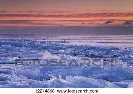 Stock Photo - Broken shards of ice at sunrise along the North Shore of Lake Superior, near Duluth; Minnesota, United States of America. Fotosearch