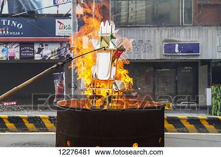 Burning paper offerings on a street; Tainan, Taiwan View Large Photo Image Stock Image - Burning paper offerings on a street; Tainan, Taiwan. Fotosearch