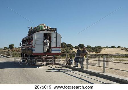Bus On A Bridge Over Fiherenana River, North Of Toliara, Madagascar View Large Photo Image Stock Photo - Bus On A Bridge Over Fiherenana River, North Of Toliara, Madagascar. Fotosearch