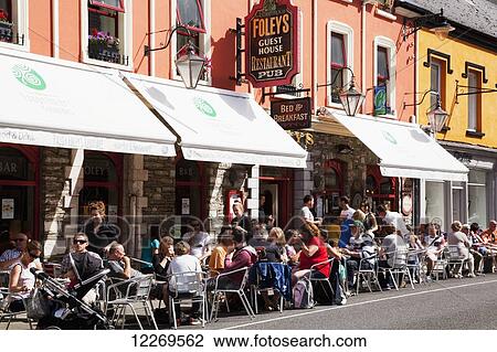 Busy patios outside restaurants along the street; Kenmare, County Kerry, Ireland View Large Photo Image Stock Image - Busy patios outside restaurants along the street; Kenmare, County Kerry, Ireland. Fotosearch