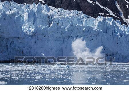 Stock Photograph - Calving Sawyer Glacier, Tracy Arm, Southeast Alaska; Alaska, United States of America. Fotosearch