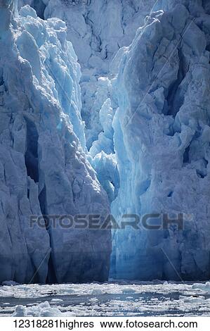 Stock Photograph - Calving Sawyer Glacier, Tracy Arm, Southeast Alaska; Alaska, United States of America. Fotosearch