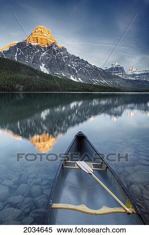 Canoe At Lower Waterfowl Lake With Mount Chephren In The Background, Banff National Park, Alberta View Large Photo Image Stock Photography - Canoe At Lower Waterfowl Lake With Mount Chephren In The Background, Banff National Park, Alberta. Fotosearch