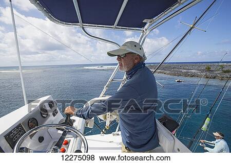 Stock Photo - Captain of the boat; Tahiti. Fotosearch