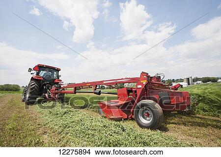 Picture - Case IH Tractor with DC132 Disc Mower cutting Alfalfa; Strasburg, Pennsylvania, United States of America. Fotosearch
