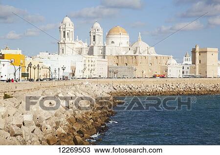 Cathedral and rugged waterfront; Cadiz, Andalusia, Spain View Large Photo Image Stock Image - Cathedral and rugged waterfront; Cadiz, Andalusia, Spain. Fotosearch
