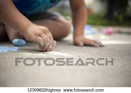 Child playing with sidewalk chalk; Regina, Saskatchewan, Canada View Large Photo Image Stock Photograph - Child playing with sidewalk chalk; Regina, Saskatchewan, Canada. Fotosearch