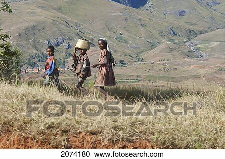 Stock Image - Children Along The Road Between Ambositra & Ambavalao, Fianarantsoa Province, Madagascar. Fotosearch