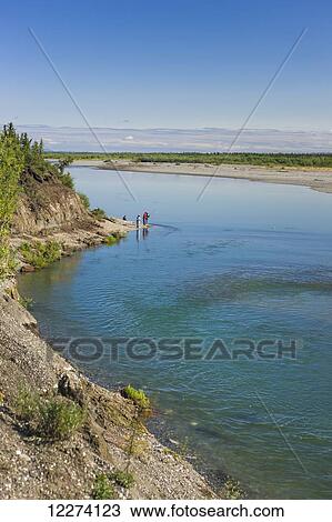 Children from Noatak Village fishing with fishing poles on the banks of the Noatak River, Noatak, Arctic Alaska, USA, Summer View Large Photo Image Stock Image - Children from Noatak Village fishing with fishing poles on the banks of the Noatak River, Noatak, Arctic Alaska, USA, Summer. Fotosearch