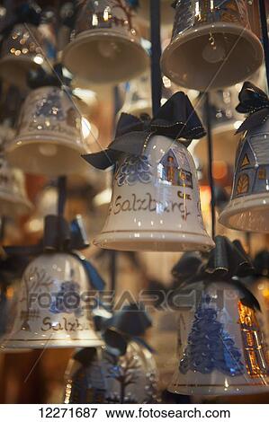 Christmas decorations in the form of ceramic bells with snow-covered trees and log cabins; Salzburg, Austria View Large Photo Image Stock Photo - Christmas decorations in the form of ceramic bells with snow-covered trees and log cabins; Salzburg, Austria. Fotosearch
