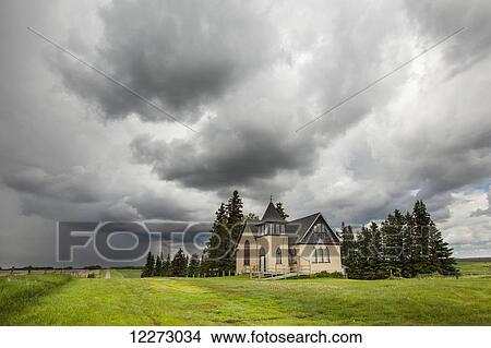 Church in a rural setting with storm clouds overhead; Winnipeg, Manitoba, Canada View Large Photo Image Picture - Church in a rural setting with storm clouds overhead; Winnipeg, Manitoba, Canada. Fotosearch