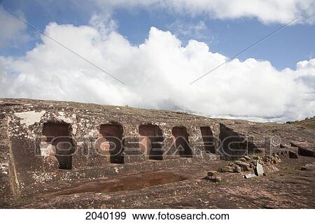 Stock Photo - Cinco Hornacinas (Five Niches) On The Carved Stone Hill Of El Fuerte De Samaipata, Santa Cruz Department, Bolivia. Fotosearch