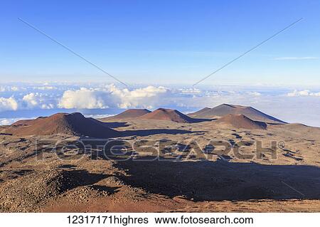 Stock Photograph - Cinder cones and caldera from ancient lava eruptions atop 4200 meter Mauna Kea, tallest mountain in Hawaii; Island of Hawaii, Hawaii, United States of America. Fotosearch