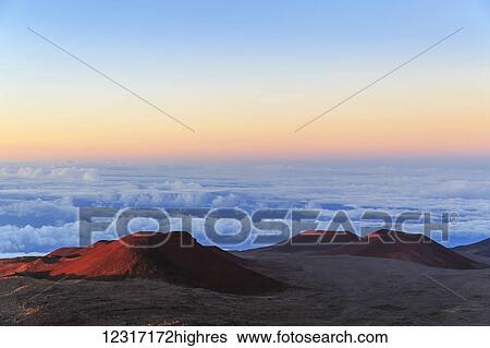 Stock Photograph - Cinder cones and caldera from ancient lava eruptions atop 4200 meter Mauna Kea, tallest mountain in Hawaii, at sunset; Island of Hawaii, Hawaii, United States of America. Fotosearch