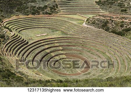 Stock Photograph - Circular terraces of Moray, town of Maras in Sacred Valley of Peru; Moray, Cusco, Peru. Fotosearch