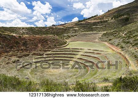 Stock Photograph - Circular terraces of Moray, town of Maras in Sacred Valley of Peru; Moray, Cusco, Peru. Fotosearch