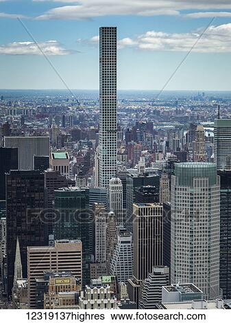 Cityscape of New York City with skyscrapers in Manhattan and 432 Park Avenue, a residential skyscraper; New York City, New York, United States of America View Large Photo Image Stock Photograph - Cityscape of New York City with skyscrapers in Manhattan and 432 Park Avenue, a residential skyscraper; New York City, New York, United States of America. Fotosearch