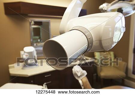 Stock Photo - Close up of a dental x-ray machine in a dental office; United States of America. Fotosearch