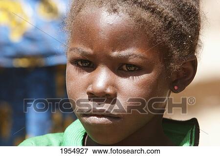 Close-up of a young Dogon girl in Neni, Mali View Large Photo Image Stock Photo - Close-up of a young Dogon girl in Neni, Mali. Fotosearch