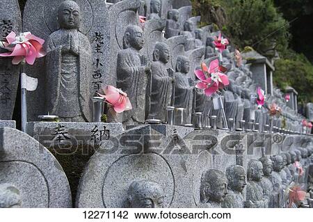 Close up of Japanese Buddha statues with flowers; Kyoto, Japan View Large Photo Image Stock Image - Close up of Japanese Buddha statues with flowers; Kyoto, Japan. Fotosearch