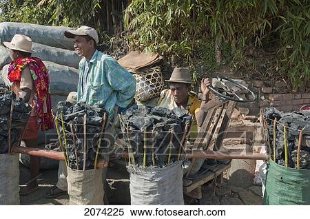 Coal Vendor At The Weekly Market In Fianarantsoa, Madagascar View Large Photo Image Stock Photography - Coal Vendor At The Weekly Market In Fianarantsoa, Madagascar. Fotosearch