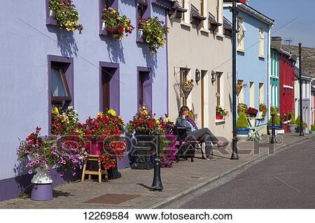 Colourful buildings and decorative flowers along the street; Ardgroom, County Cork, Ireland View Large Photo Image Picture - Colourful buildings and decorative flowers along the street; Ardgroom, County Cork, Ireland. Fotosearch