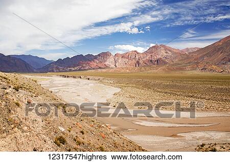 Stock Photograph - Colourful desert valley in the Andes; Upsallata, Mendoza, Argentina. Fotosearch