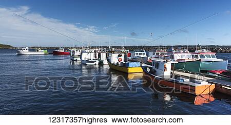 Colourful fishing boats in the harbour; Main-a-dieu, Nova Scotia, Canada View Large Photo Image Stock Photograph - Colourful fishing boats in the harbour; Main-a-dieu, Nova Scotia, Canada. Fotosearch