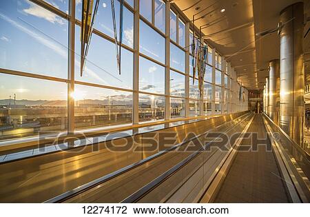Stock Image - Concourse A of the Ted Stevens Anchorage International Airport at sunset, Anchorage, Southcentral Alaska, USA. Fotosearch