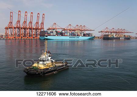 Container ships and tug, Salalah Port; Salalah, Dhofar, Oman View Large Photo Image Stock Photograph - Container ships and tug, Salalah Port; Salalah, Dhofar, Oman. Fotosearch