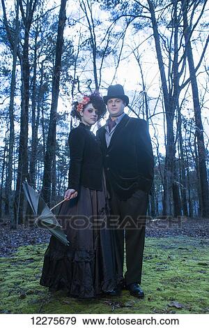 Stock Photo - Couple dressed in gothic theme for their engagement portrait; Pittsboro, North Carolina, USA. Fotosearch
