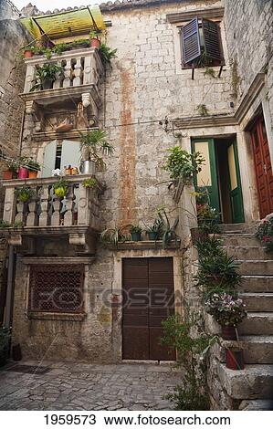 Stock Image - Courtyard Of A Residential Structure In Trogir, Split-Dalmatia, Croatia. Fotosearch
