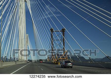 Crossing the Port Mann Bridge from Surrey to Coquitlam; British Columbia, Canada View Large Photo Image Stock Photography - Crossing the Port Mann Bridge from Surrey to Coquitlam; British Columbia, Canada. Fotosearch