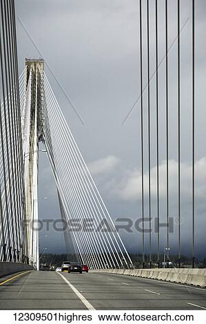 Stock Photograph - Crossing the Port Mann Bridge into New Westminster from Surrey; Surrey, British Columbia, Canada. Fotosearch