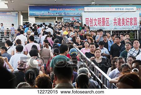 Stock Photography - Crowd taking the ferry from Xiamen to the touristic Gulang Islet; Xiamen, Fujian Province, China. Fotosearch