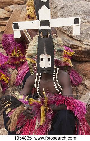 Dancer wearing Kananga mask at the Dama celebration in Tireli, Mali View Large Photo Image Stock Photography - Dancer wearing Kananga mask at the Dama celebration in Tireli, Mali. Fotosearch