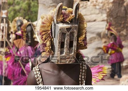 Dancers wearing Kananga mask at the Dama celebration in Tireli, Mali View Large Photo Image Stock Image - Dancers wearing Kananga mask at the Dama celebration in Tireli, Mali. Fotosearch