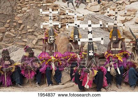 Dancers wearing Kananga mask at the Dama celebration in Tireli, Mali View Large Photo Image Stock Photo - Dancers wearing Kananga mask at the Dama celebration in Tireli, Mali. Fotosearch