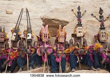 Dancers wearing Kananga mask at the Dama celebration in Tireli, Mali View Large Photo Image Stock Photo - Dancers wearing Kananga mask at the Dama celebration in Tireli, Mali. Fotosearch