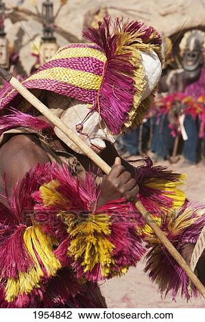 Stock Image - Dancers wearing Kananga masks perform at the Dama celebration in Tireli, Mali. Fotosearch
