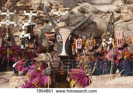 Dancers wearing Kananga masks perform at the Dama celebration in Tireli, Mali View Large Photo Image Stock Image - Dancers wearing Kananga masks perform at the Dama celebration in Tireli, Mali. Fotosearch
