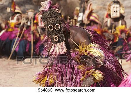 Stock Image - Dancers wearing Kananga masks perform at the Dama celebration in Tireli, Mali. Fotosearch